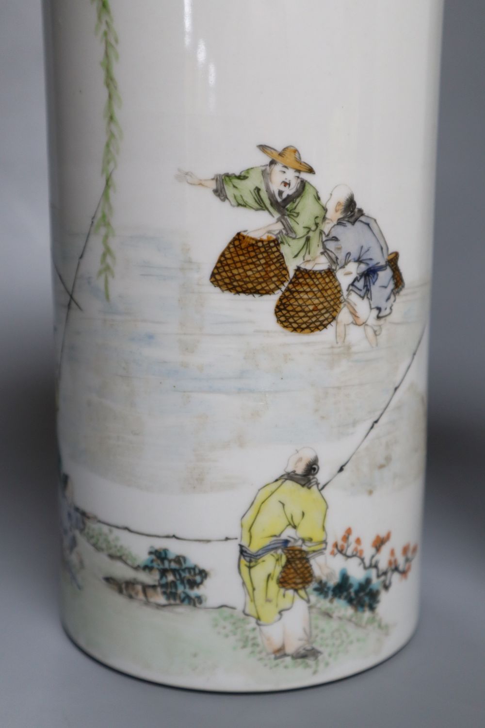 A pair of Chinese cylindrical porcelain vases, enamelled with fisherfolk, 29cm